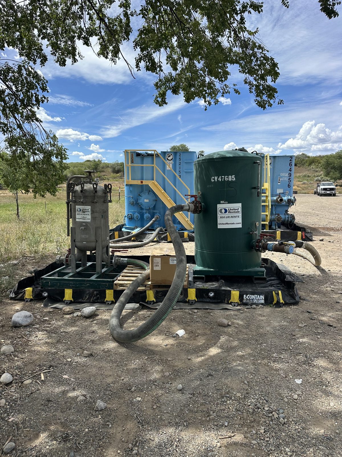 Filtration and carbon treatment train on lined containment
