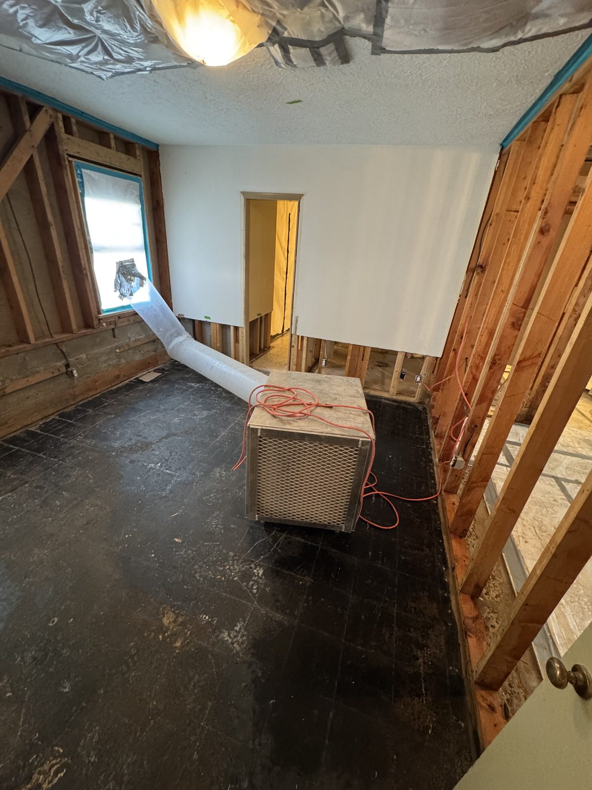 Negative air machine running during flooring removal