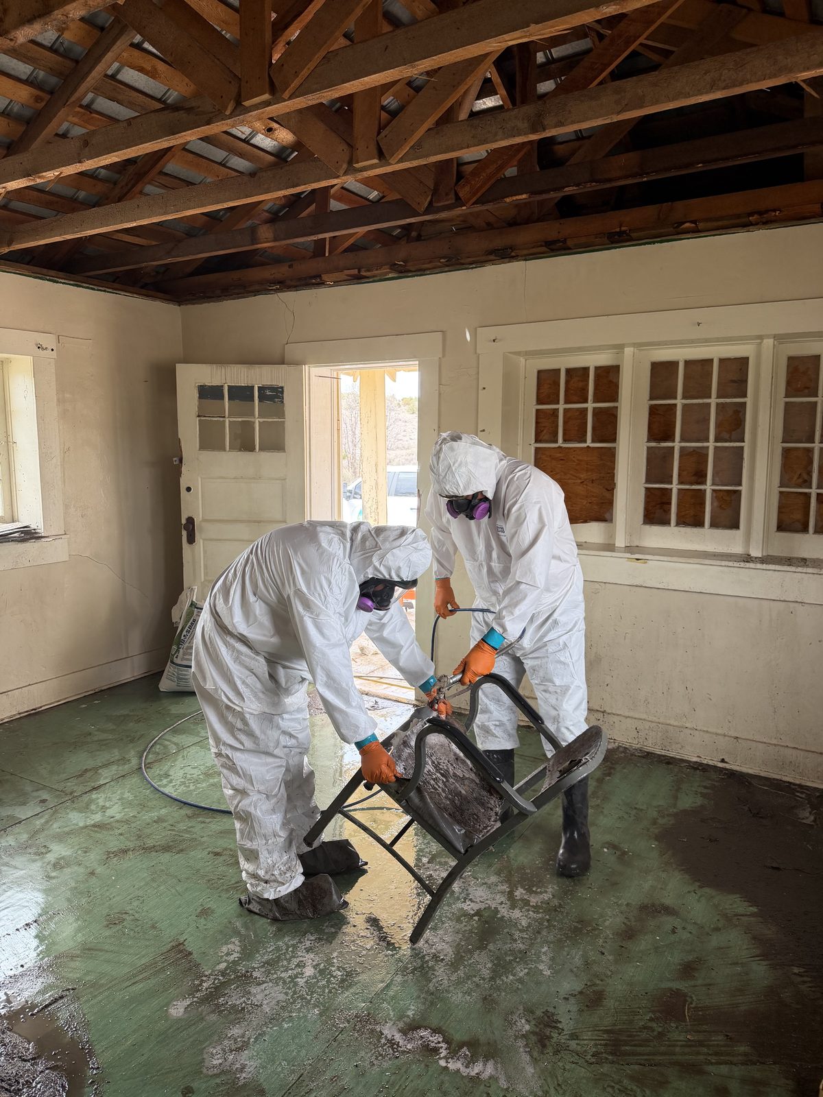 Two-technician crew working a contaminated structure