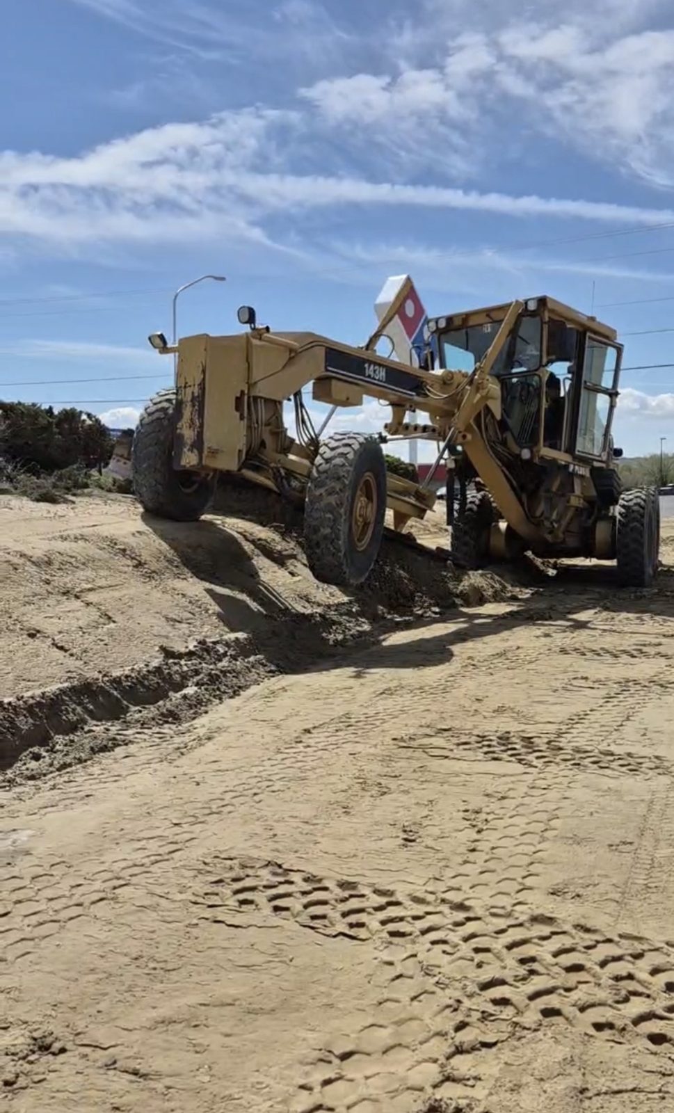 Grading and site prep behind the removal