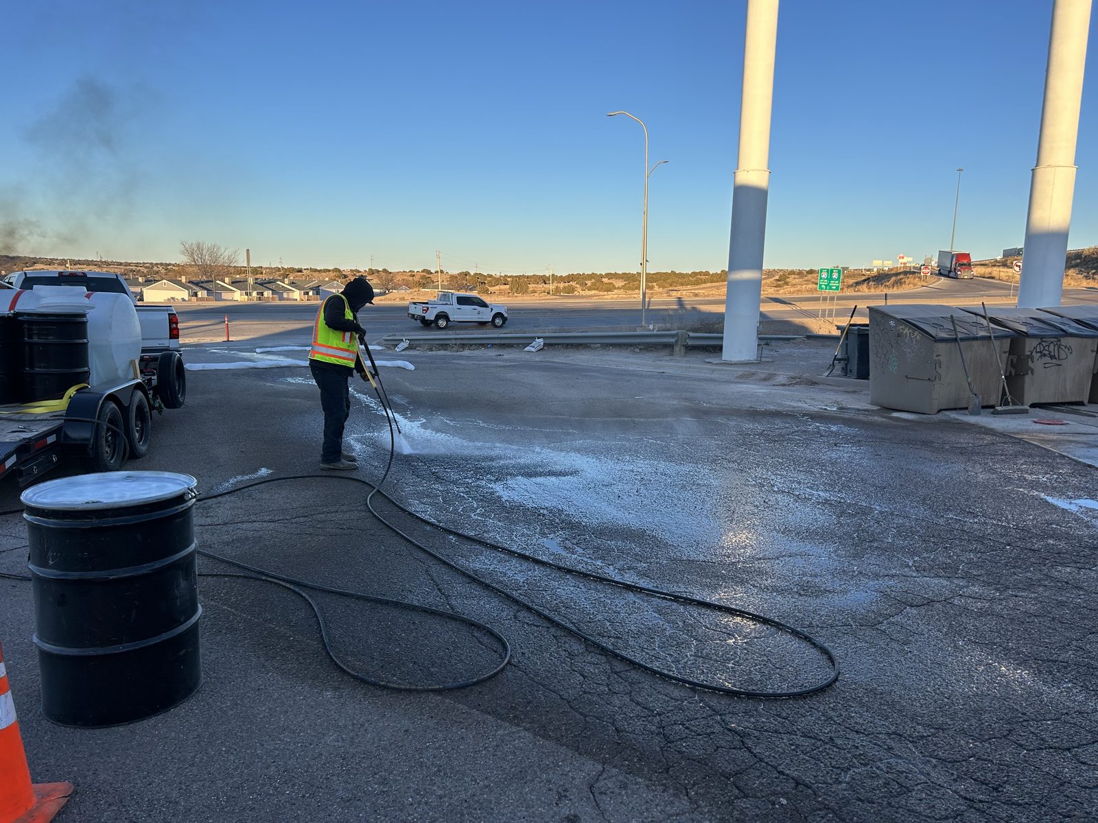 Heated wash and recovery at a fuel island, wash water drummed on site